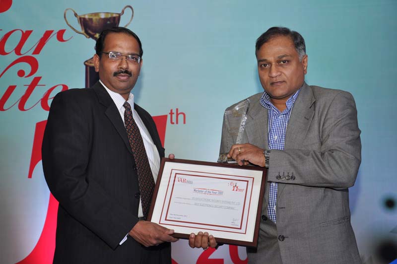 Mr. Hemal Patel,CEO-Cyberoam Technologies giving away award to Zicom